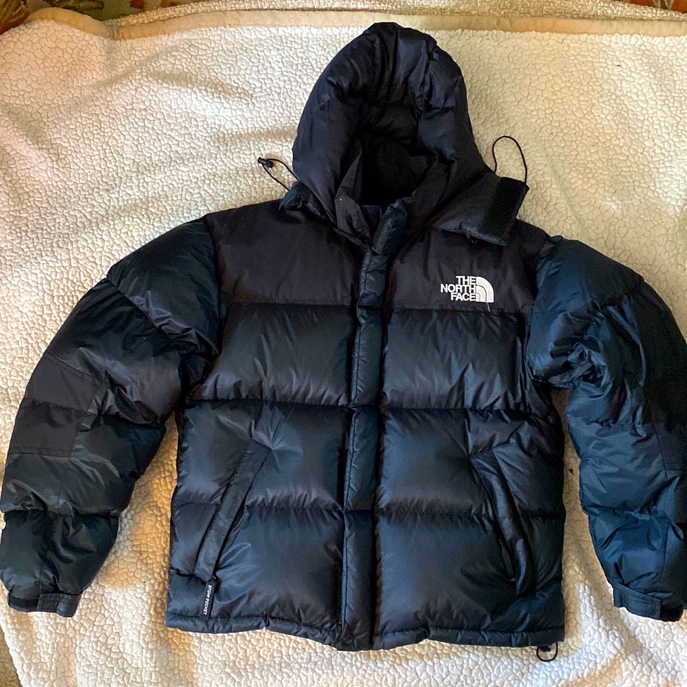 The North Face black puffer jacket.